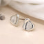 POM Silver plated wavy surface heart stud earrings