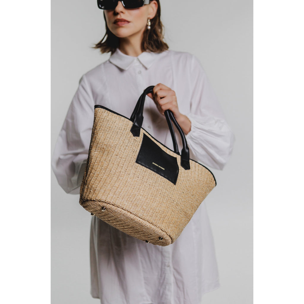 Every Other Wicker style satchel bag with crossbody strap and pouch.