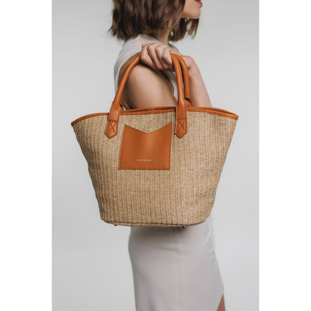 Every Other Wicker style satchel bag with crossbody strap and pouch.